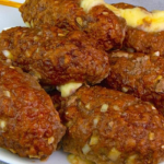 Meat skewers stuffed with cheese